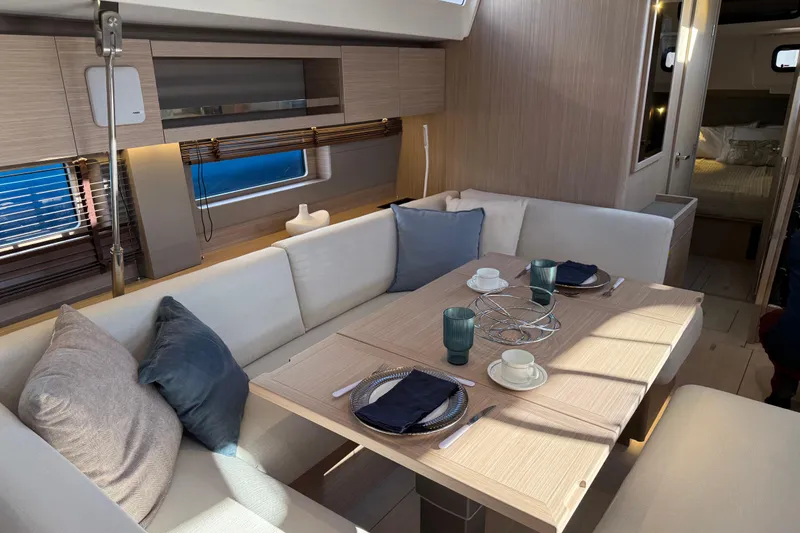 Slide: The Image of Luxurious interior of 2026 Beneteau Oceanis 52 yacht with elegant dining area. - 11