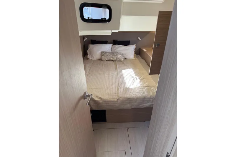 Slide: The Image of Cozy cabin interior of 2026 Beneteau Oceanis 52 yacht with comfortable bedding. - 14