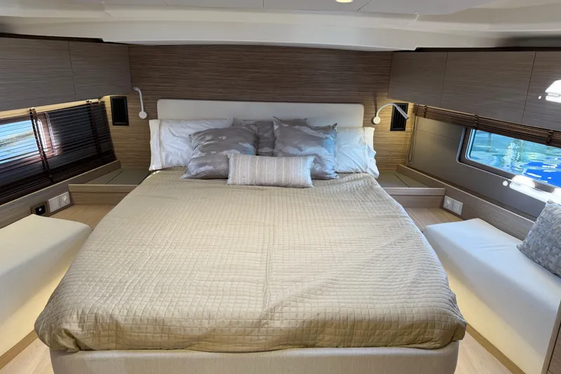 Slide: The Image of Luxurious cabin interior of 2026 Beneteau Oceanis 52 yacht with elegant bedding and modern design. - 15