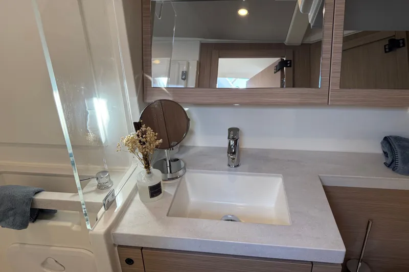 Slide: The Image of Modern bathroom interior of 2026 Beneteau Oceanis 52 yacht with sleek sink and mirror. - 16