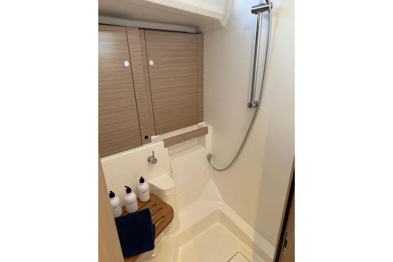 Slide: The Image of Modern bathroom in 2026 Beneteau Oceanis 52 yacht with shower and wooden accents. - 18