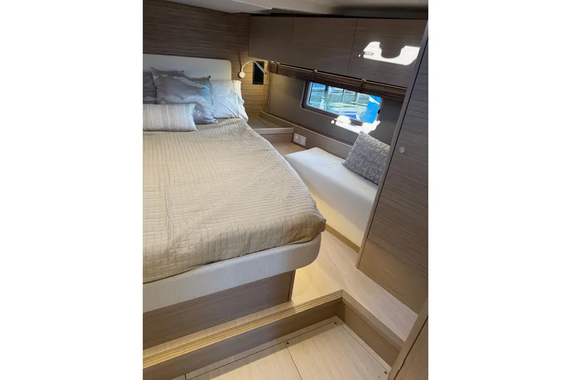 Slide: The Image of Luxurious cabin interior of 2026 Beneteau Oceanis 52 yacht with cozy bedding and modern design. - 19