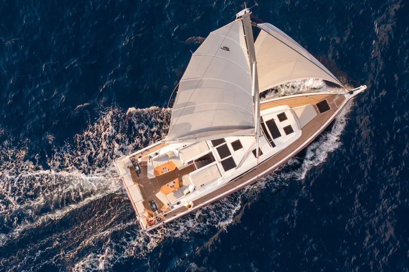 Slide: The Image of Aerial view of 2026 Beneteau Oceanis 52 sailing yacht on open sea. - 3