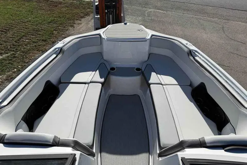 Slide: The Image of 2026 Yamaha Boats AR250 interior with spacious seating and modern design. - 11