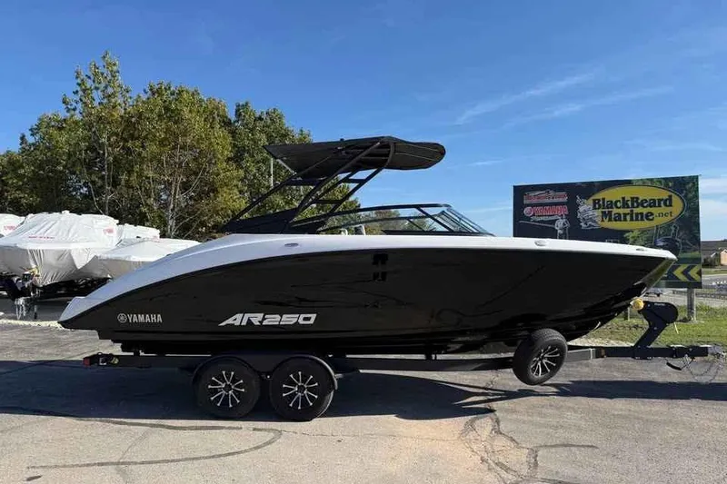 Slide: The Image of 2026 Yamaha Boats AR250 on trailer at BlackBeard Marine dealership. - 4