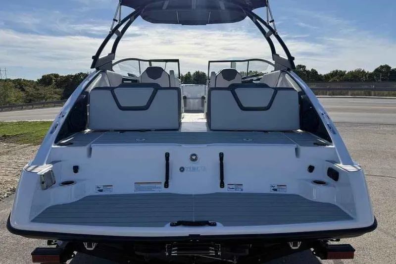 Slide: The Image of 2026 Yamaha Boats AR250 rear view, showcasing spacious deck and seating. - 5