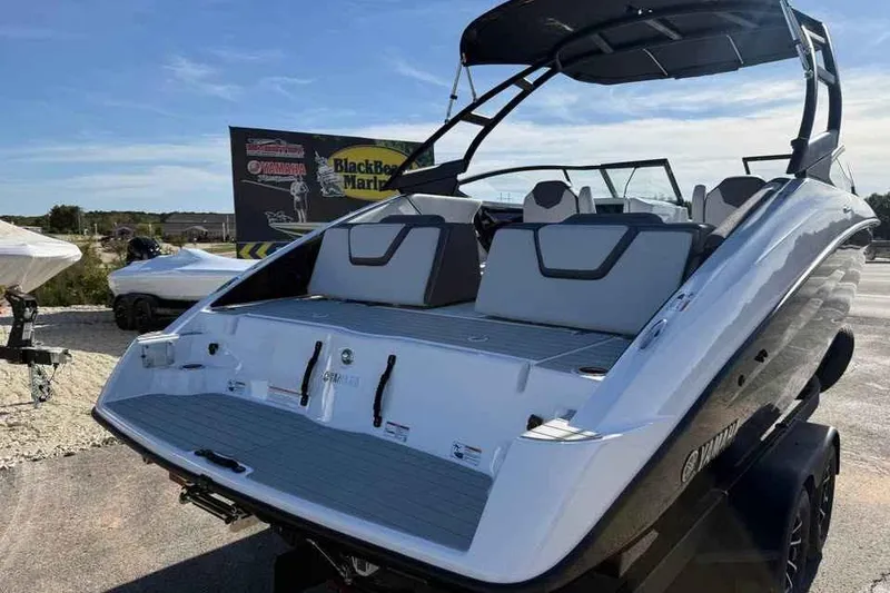 Slide: The Image of 2026 Yamaha Boats AR250, sleek design, rear view, outdoor display. - 6