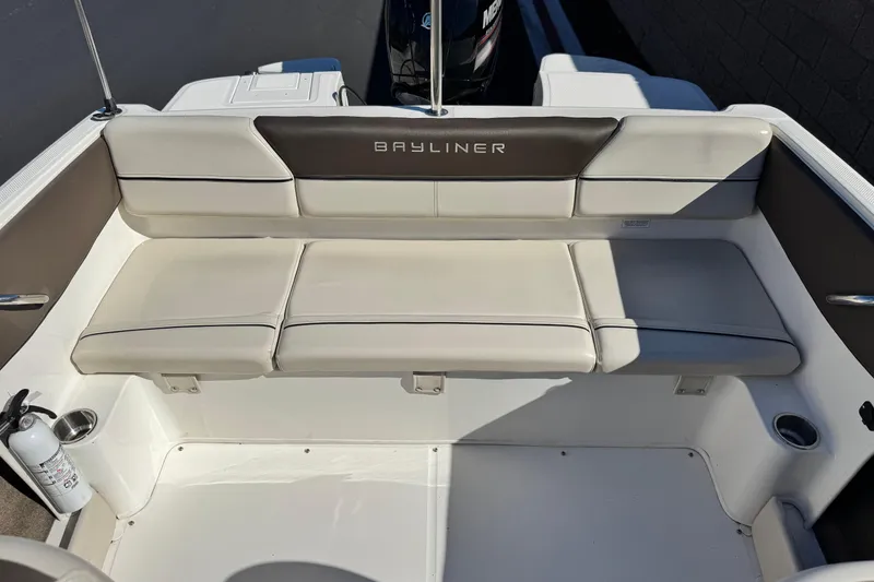 Slide: The Image of 2019 Bayliner 180 Bowrider boat interior with cushioned seating and fire extinguisher. - 15