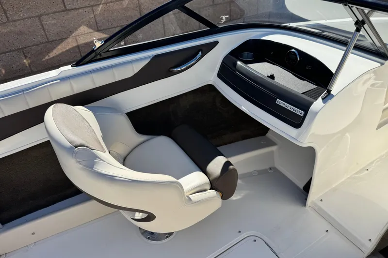 Slide: The Image of 2019 Bayliner 180 Bowrider interior with sleek seating and modern dashboard design. - 18