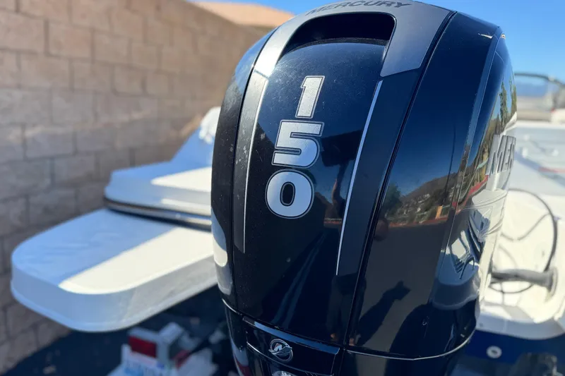 Slide: The Image of 2019 Bayliner 180 Bowrider with Mercury 150 outboard engine, close-up view. - 7