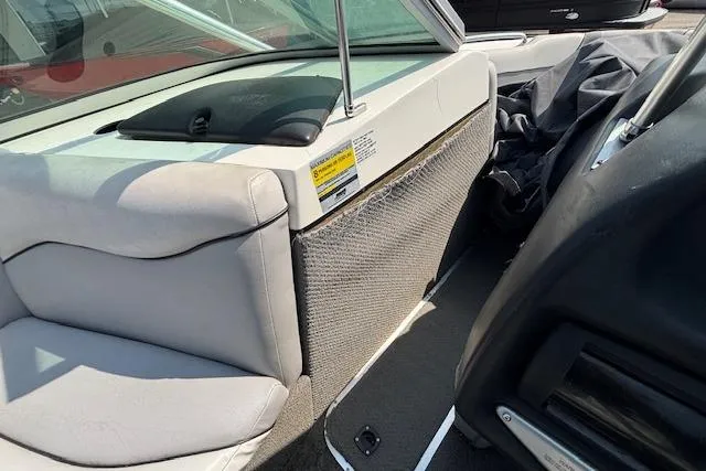 Slide: The Image of Interior of 2007 Centurion Air Warrior T5 boat, featuring seating and storage area. - 12