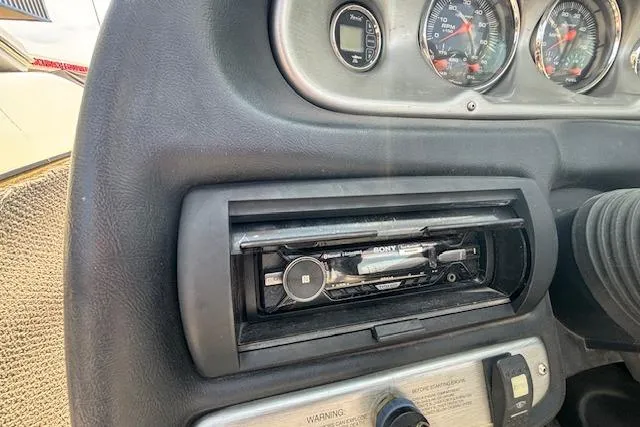 Slide: The Image of Dashboard of 2007 Centurion Air Warrior T5 with Sony stereo and gauges. - 13