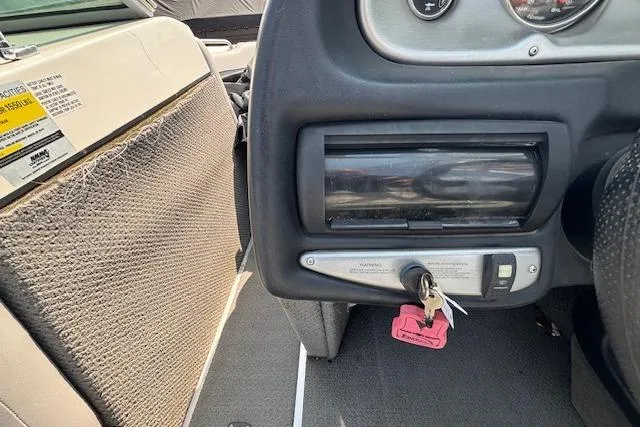 Slide: The Image of 2007 Centurion Air Warrior T5 dashboard with ignition keys and control panel. - 14