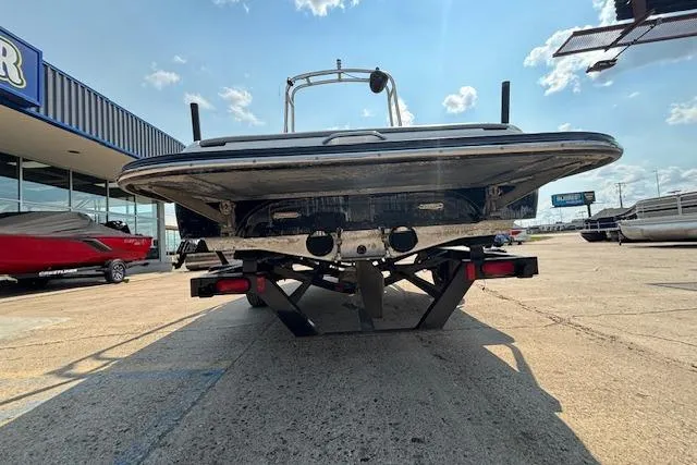 Slide: The Image of 2007 Centurion Air Warrior T5 boat on trailer, rear view under sunny sky. - 24
