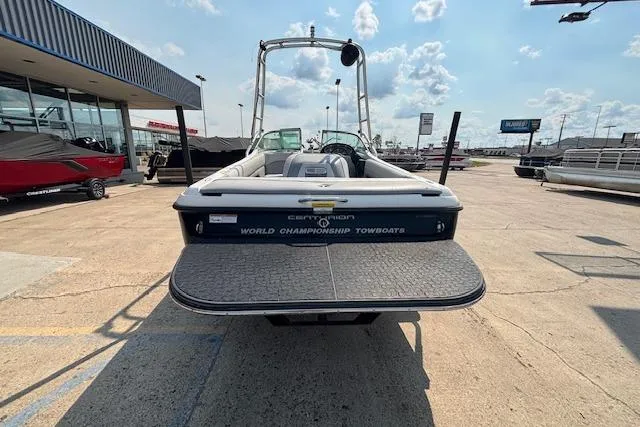 Slide: The Image of 2007 Centurion Air Warrior T5 boat at a dealership, showcasing rear view and swim platform. - 26
