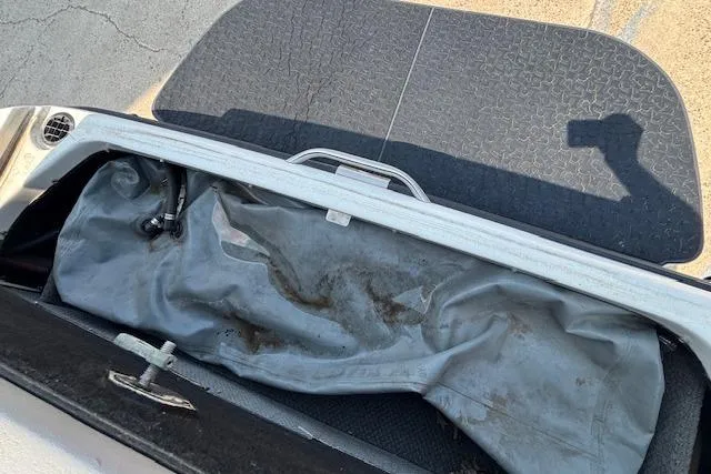 Slide: The Image of Open storage compartment of a 2007 Centurion Air Warrior T5 boat, showing interior details. - 4