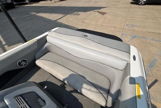 Slide: The Image of 2007 Centurion Air Warrior T5 boat interior with gray seating and speaker. - 5