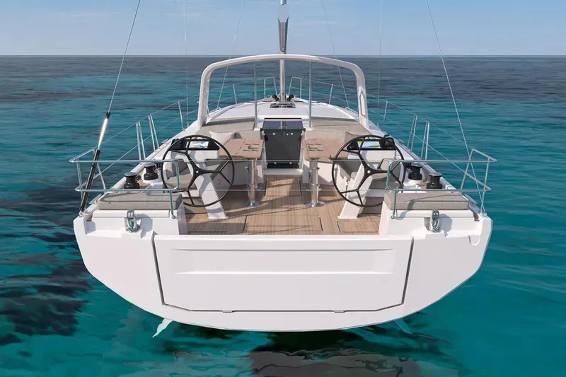 Slide: The Image of 2026 Beneteau Oceanis 47 yacht, rear view, on clear blue water. - 2