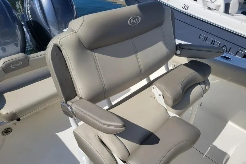 Slide: The Image of 2023 Key West 244 Center Console boat seating with armrests and logo. - 3