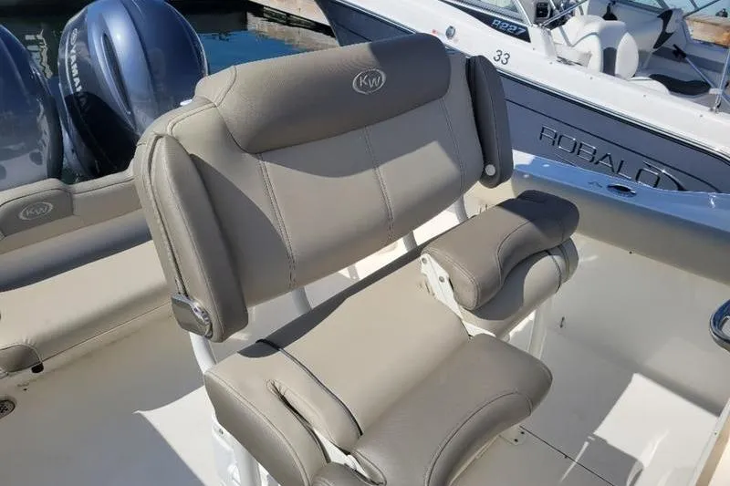 Slide: The Image of 2023 Key West 244 Center Console boat with comfortable seating and dual engines. - 7