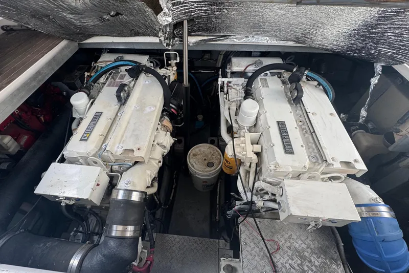 Slide: The Image of Engine compartment of a 1998 Sea Ray 400 Sundancer with dual Caterpillar engines. - 15