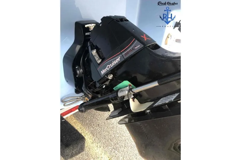 Slide: The Image of 2022 Monterey M6 boat with MerCruiser Bravo Three engine, Rock Harbor Boats logo visible. - 10