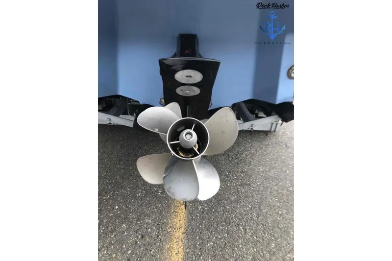 Slide: The Image of 2022 Monterey M6 boat propeller on pavement, showcasing sleek design and engineering. - 5