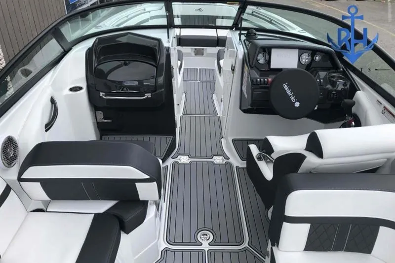 Slide: The Image of 2022 Monterey M6 boat interior with sleek black and white seating and modern dashboard. - 6
