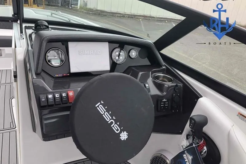 Slide: The Image of 2022 Monterey M6 boat dashboard with Simrad display and steering wheel cover. - 8