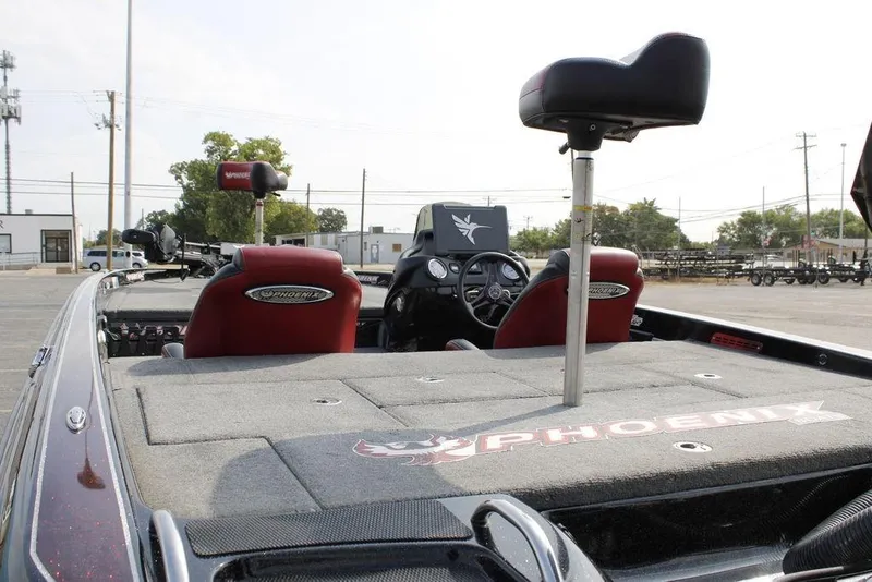 Slide: The Image of 2021 Phoenix 21 PHX boat interior with red seats and steering console. - 12