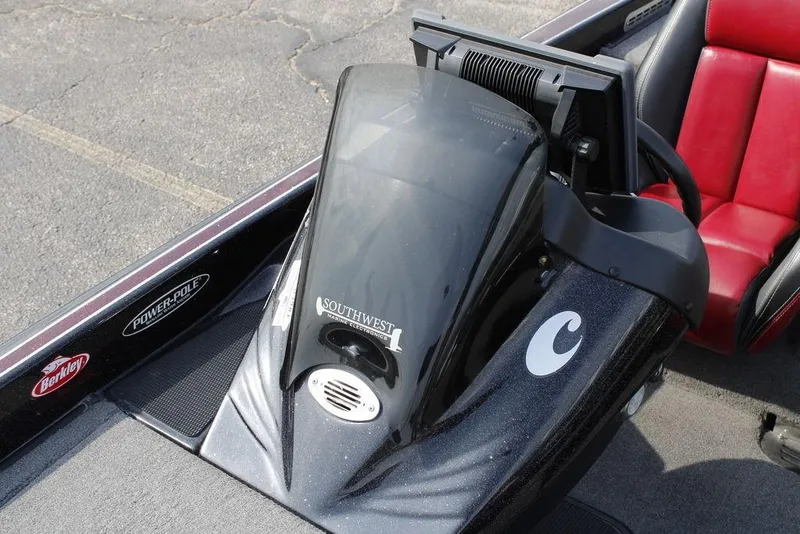 Slide: The Image of 2021 Phoenix 21 PHX boat interior with red seats and marine electronics. - 14