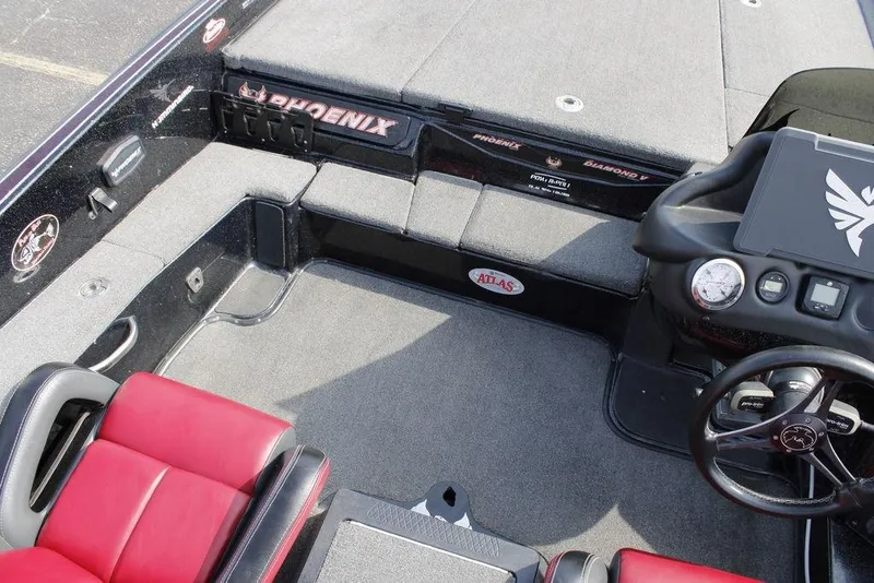 Slide: The Image of Interior of 2021 Phoenix 21 PHX boat with red seats and steering console. - 20