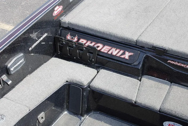 Slide: The Image of 2021 Phoenix 21 PHX boat interior with Humminbird electronics and cushioned seating. - 22