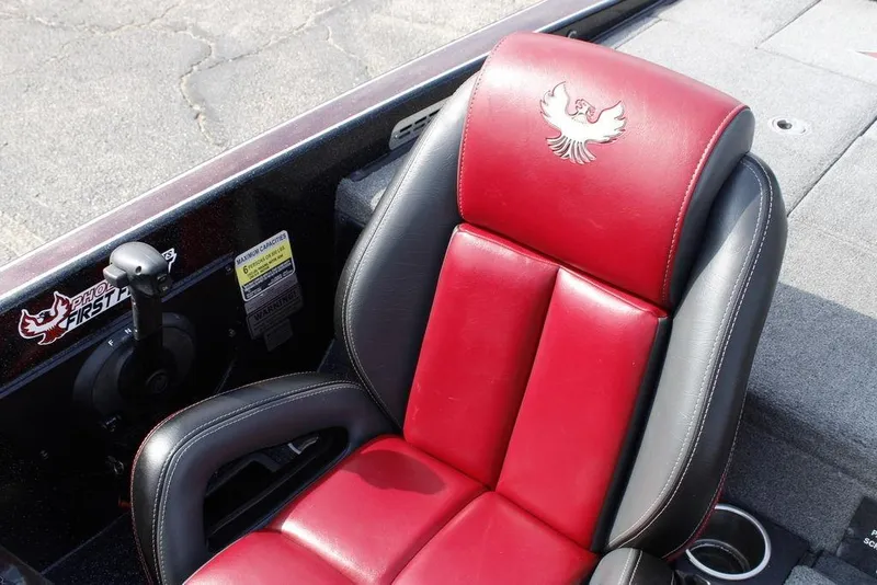 Slide: The Image of Red and black boat seat in 2021 Phoenix 21 PHX, featuring embroidered logo. - 23