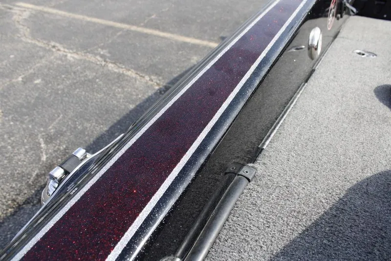 Slide: The Image of 2021 Phoenix 21 PHX boat deck with metallic red and black detailing. - 35