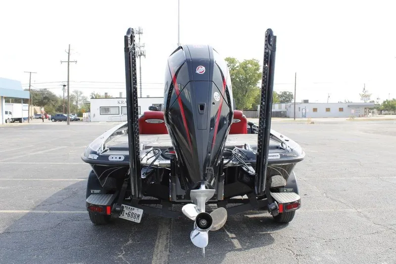 Slide: The Image of 2021 Phoenix 21 PHX boat rear view with motor in parking lot. - 8
