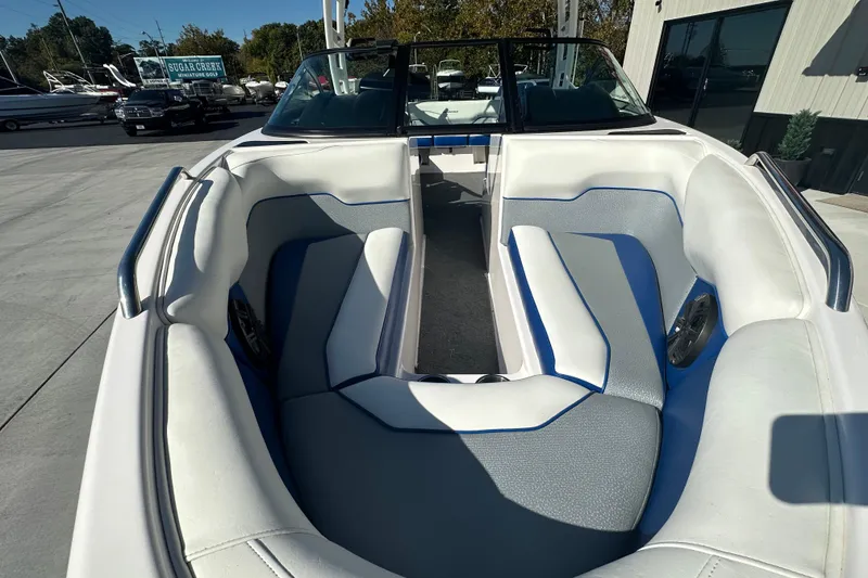 Slide: The Image of Close-up of 2015 Moomba Mobius LSV boat with shiny logo on blue hull. - 11