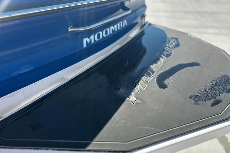 Slide: The Image of 2015 Moomba Mobius LSV boat interior with white and gray seating. - 14