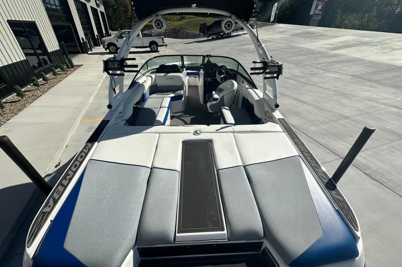 Slide: The Image of 2015 Moomba Mobius LSV boat interior with spacious seating and modern design. - 17