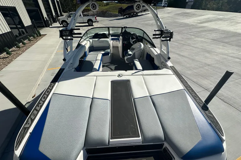 Slide: The Image of 2015 Moomba Mobius LSV boat interior with wakeboard rack and steering wheel. - 18