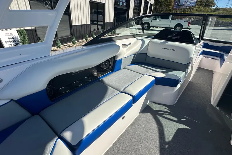 Slide: The Image of 2015 Moomba Mobius LSV battery switch with red cables and circuit breaker. - 24