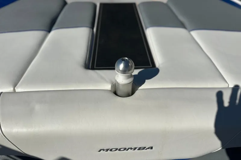 Slide: The Image of 2015 Moomba Mobius LSV boat storage compartment with black plastic components and cables. - 33