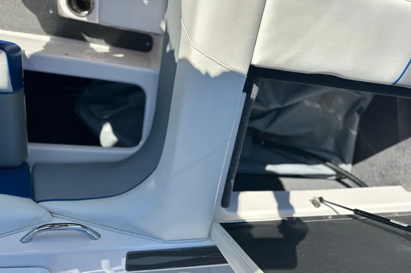 Slide: The Image of 2015 Moomba Mobius LSV interior storage compartment with upholstery and carpet details. - 36