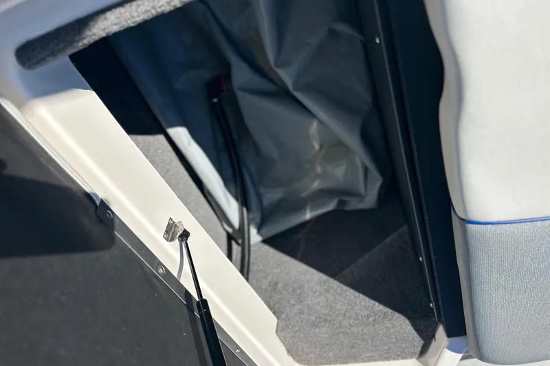 Slide: The Image of 2015 Moomba Mobius LSV boat interior storage compartment with blue and gray upholstery. - 38