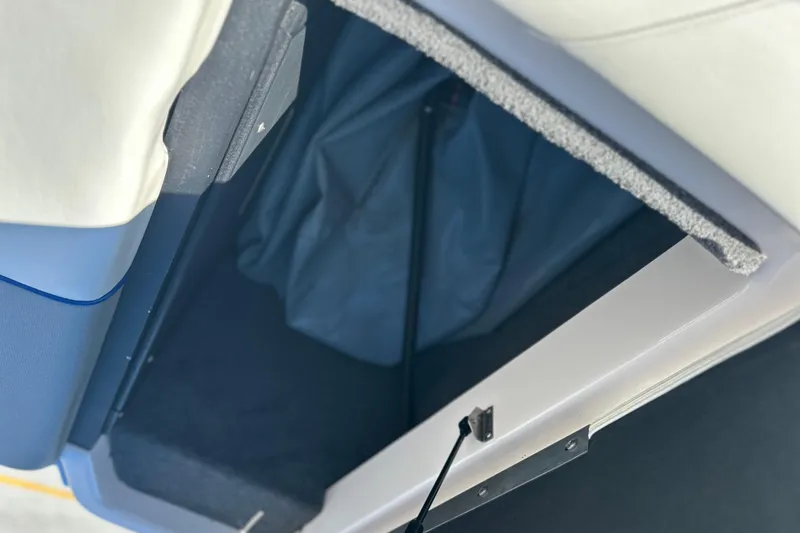 Slide: The Image of 2015 Moomba Mobius LSV boat interior with open storage compartments. - 39