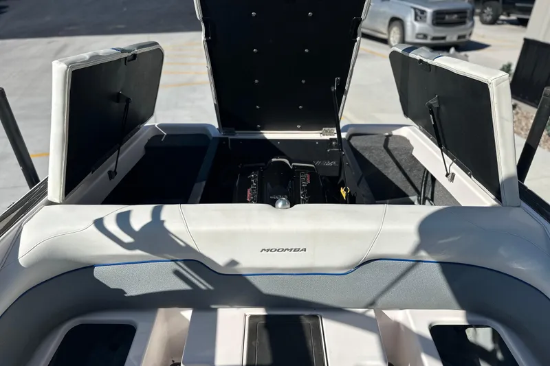 Slide: The Image of 2015 Moomba Mobius LSV boat interior with blue and white seating. - 42