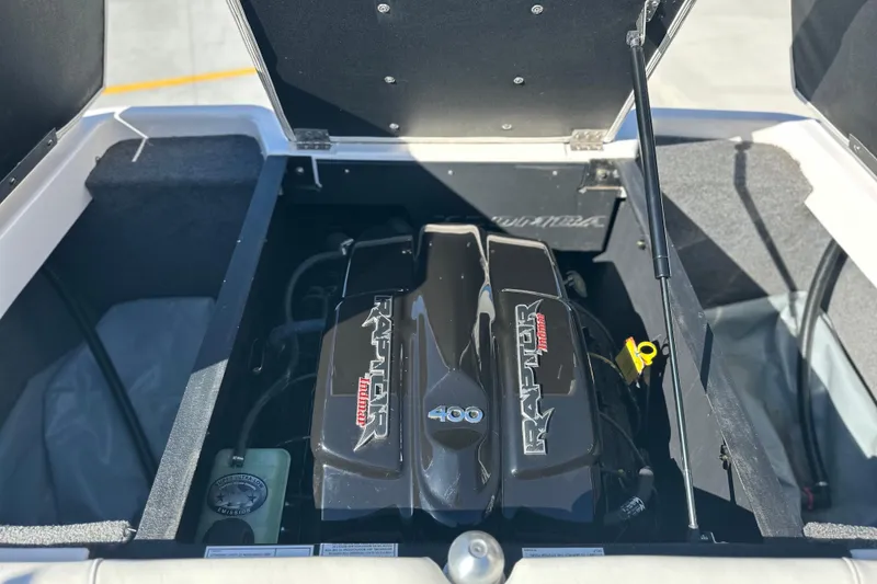 Slide: The Image of 2015 Moomba Mobius LSV boat interior with open windshield and seating area. - 43