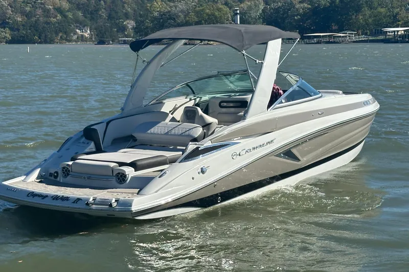 Slide: The Image of 2015 Moomba Mobius LSV boat on calm water, front view. - 50