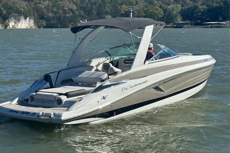 Slide: The Image of 2015 Moomba Mobius LSV boat on a calm lake with scenic background. - 51