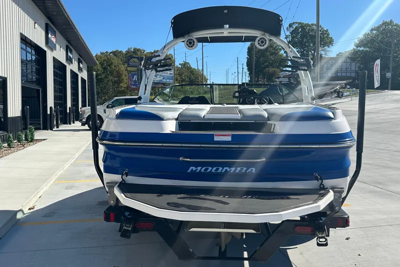 Slide: The Image of 2015 Moomba Mobius LSV boat on trailer in parking lot, sunny day. - 6